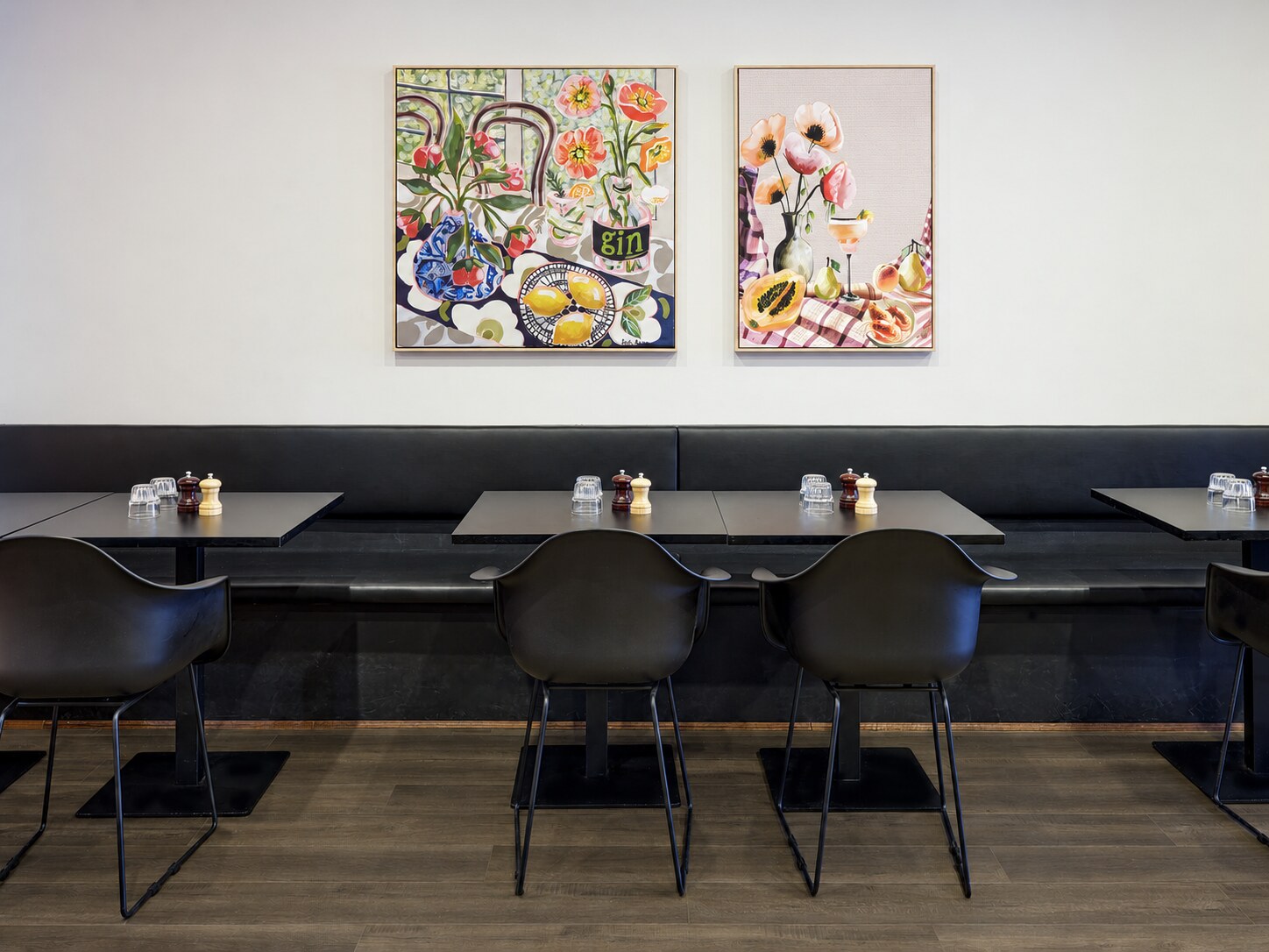 Bella Mamma dining area, artwork and refined dark timber floor