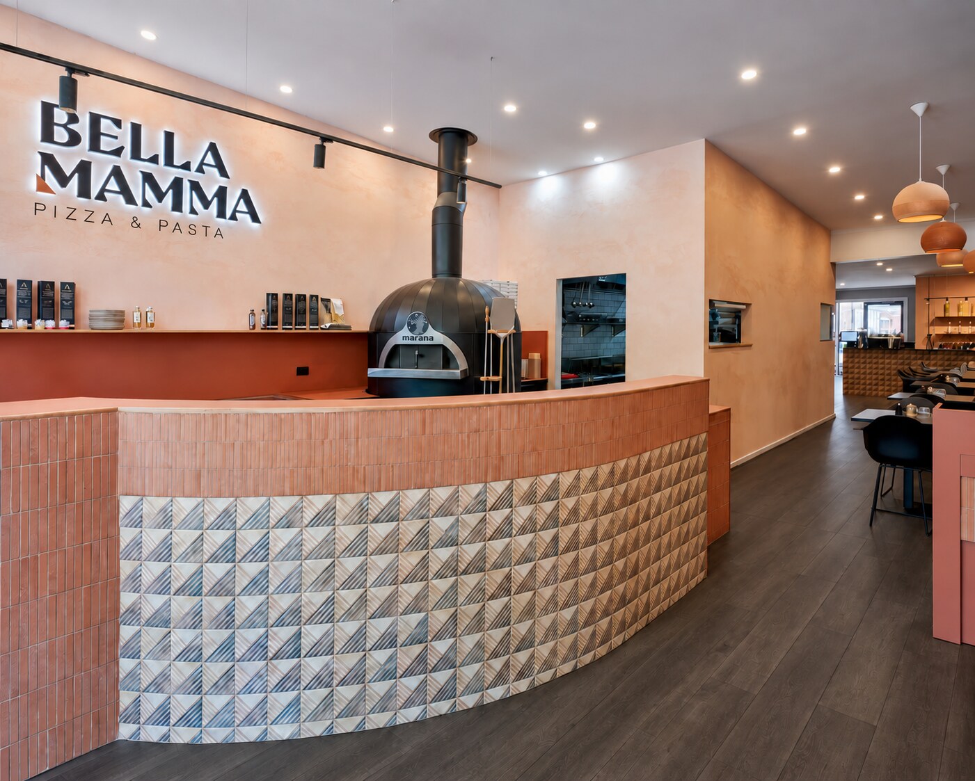 Bella Mamma Pizzeria interior with a dark smoked-timber floor