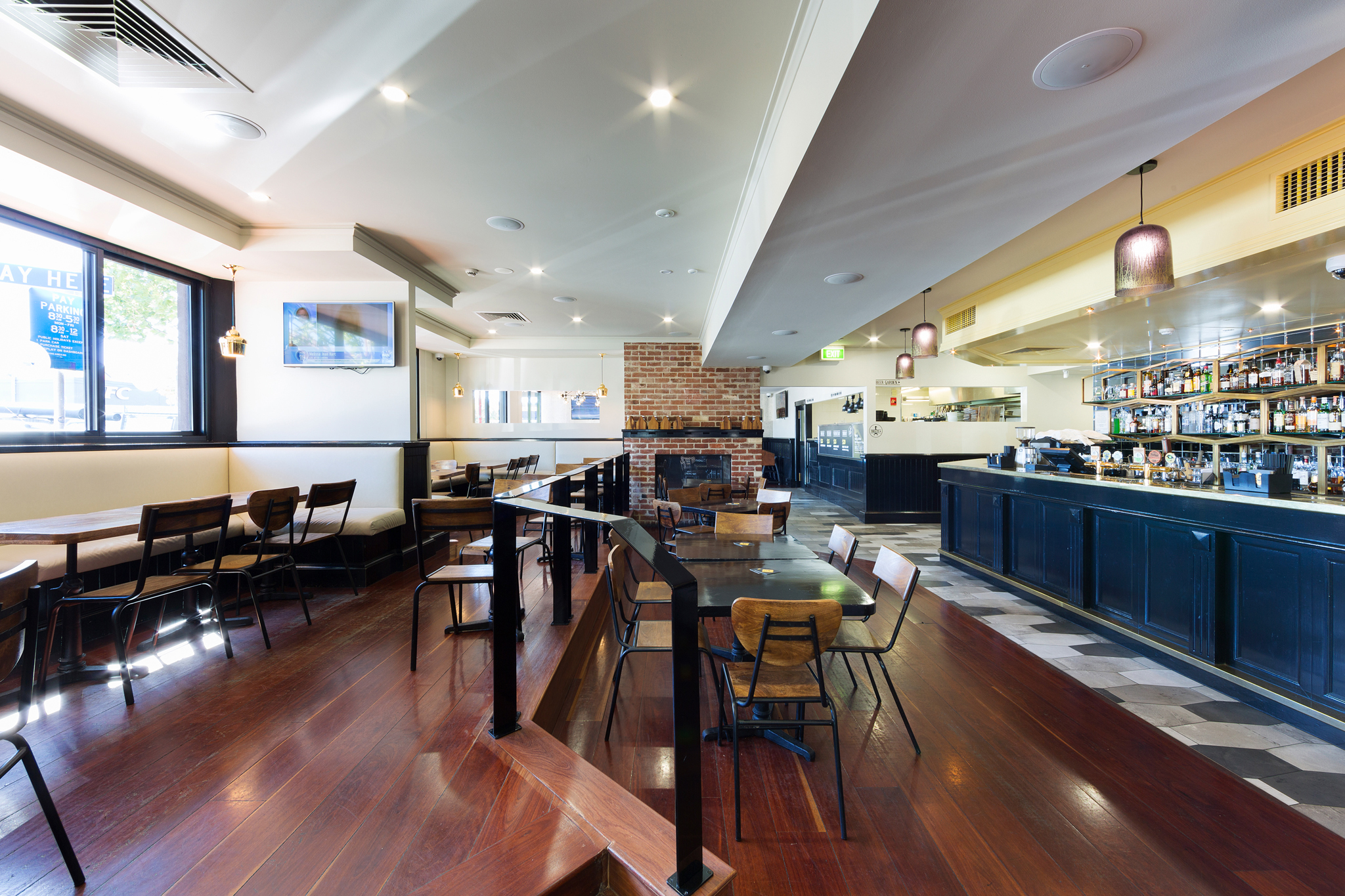 Ducks Nuts pub interior with a black bar and warm timber finishes