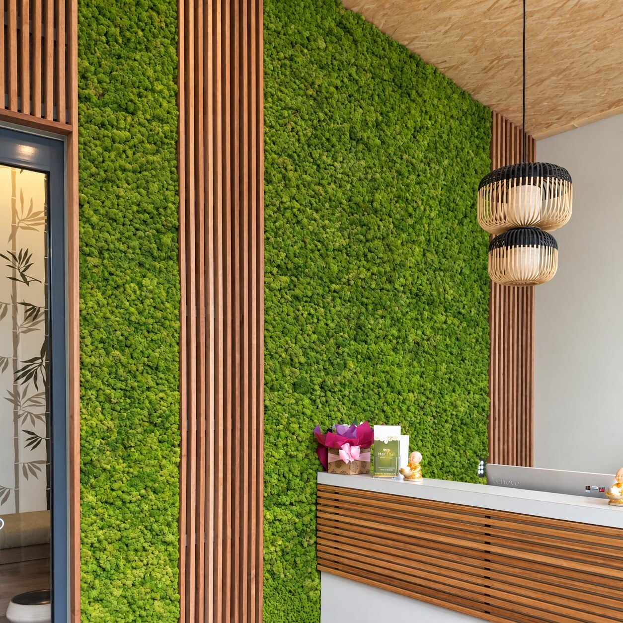 Mor Thai Massage Spa reception with a living moss wall and natural materials