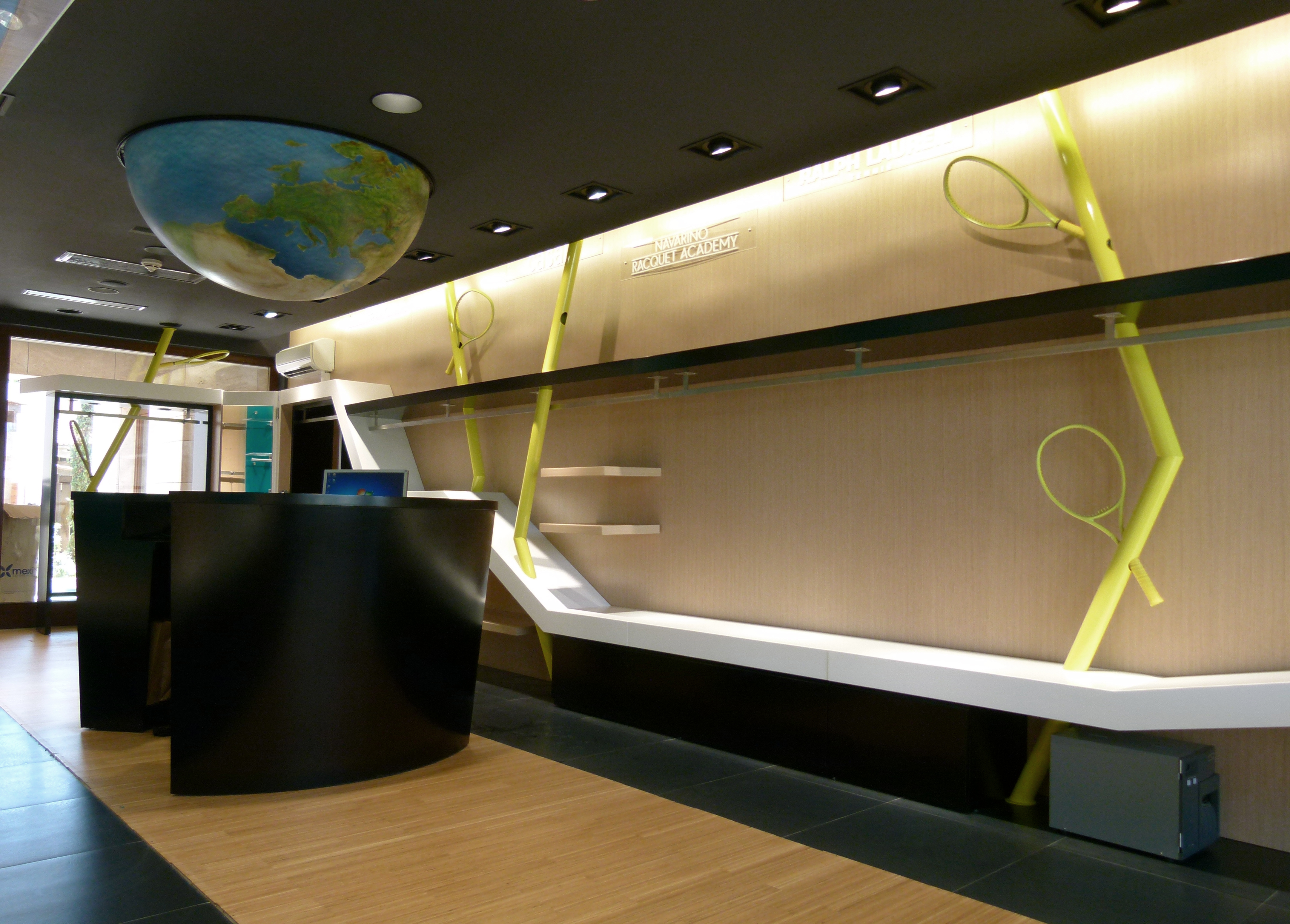 PlaySports retail interior with an overhead world map installation